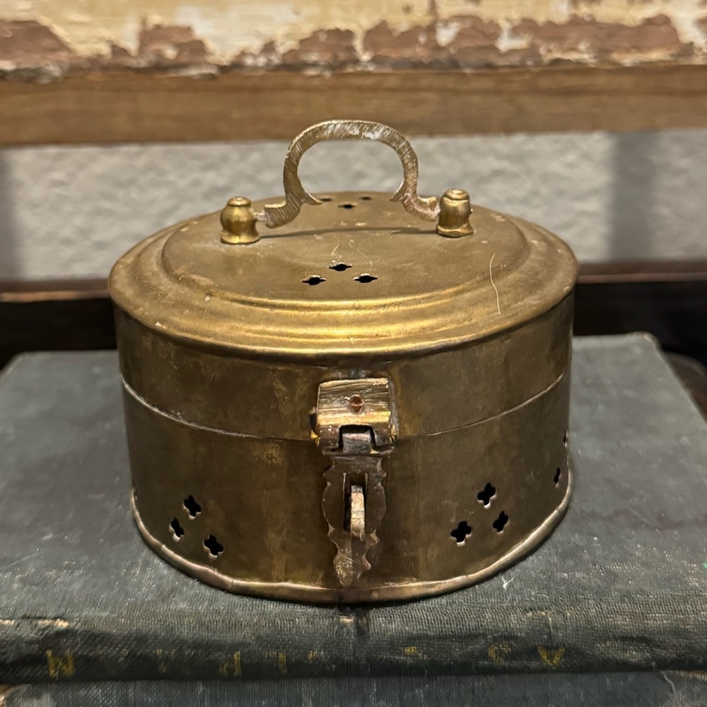 Vintage round brass cricket box
